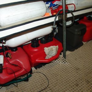 Media '21 gallons of fuel with quick disconnects, toolbox, 4 dock bumpers, 2 sponges, 2nd fire extinguisher, inflatable ball, 2 collapsable paddles, 1 small wood paddle, 2nd anchor, utility knife, hand bilge pump and electric bilge pump in there.' in album 'Sunbrella fabric with snaps and trim to clean up the back.'