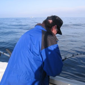 Dad\'s reeling up a halibut