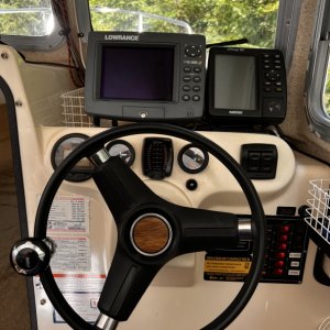 Trim Tab Switches Under B&W GPS, FWD Circuit Breaker Switches and Fuses, Boat Tilt Fuel Level and Engine Gauge on Panel