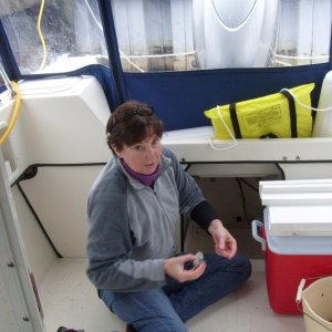 Captain clearing the bilge of water in anticipation of sub-freezing temperatures - (3JAN10)
