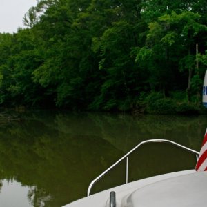 Media 'Exploring the Flint River; were the only cruiser' in album 'Tucked-in-at-Goosepond. The green led rope lights portray a ghostly image. We usually have this marina to ourselves at night.'