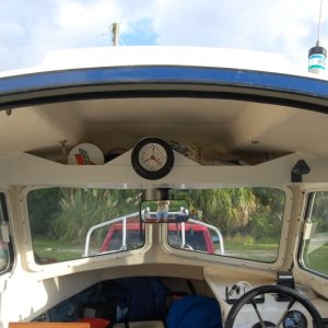 Media 'Overhead shelf in 16 with Tide Clock. Tide clock is a very useful item in my part of the country.' in album 'Factory installed receptical looking astern. Maybe 1/4 clearance between seat and receptical'