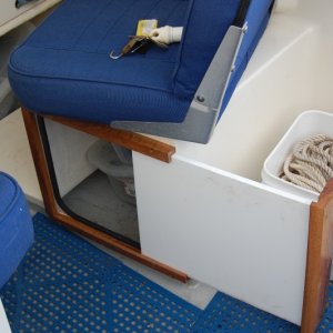 Made of starboard and mahogany. Door slides completely out and can be used as cutting board