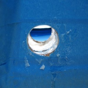 Filling the hole.  First I used a dental pick and a Dremel tool to remove the core for a good 1/2" beyond the drain hole.  Then I enlarged the hole in preparation for inserting a 1" ID (1-1/8" OD) fiberglass tube.  Then final sanding and cleaning, and I put a good coat of neat epoxy all around the hole.  After that (and will the tube prepped), I slowly built up the hole with thickened epoxy (colloidial silica).  I had to do it in layers so it would not get to hot as it kicked (but all in the span of a few hours so it was still plenty green for a chemical bond).