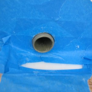 Media 'The tube bonded in on the splashwell side.  I inserted it from astern just to where I wanted it, and let it "run wild" on the outside, to be cut off later.  This made it easier to work with than a just-right-sized tube.' in album 'Brass splashwell drain tube removed. I used a hacksaw blade and cut three slits (through the tube lengthwise), then dented one edge in with a cold chisel and grabbed it with vise grips to pull it out (not hard since it was barely sealed).'