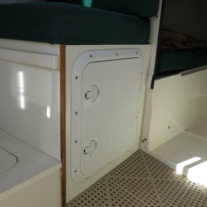 Underseat storage hatch