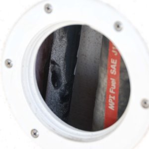 Media 'Starboard cockpit acces to fuel fill ( with red stripe) and vent lines.' in album 'Port side mounted portable cockpit step ladder forward of fuel fill system access port.'