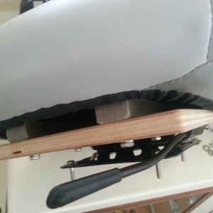 Media 'Seat appeared to be intended to be mounted on a sloping back surface.  I used some 3/4 ply and some wedge blocks to tilt the seat back to a comfortable angle.' in album 'New helm seat, Attwood Centric? model.  This is the helm seat swiveled to 45 degrees'