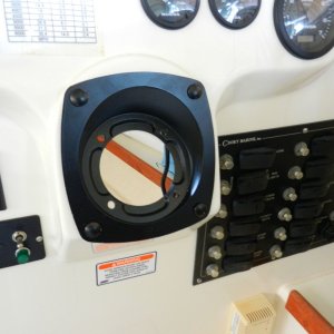 Teleflex recessed wedge bezel installed.  Tilts wheel back (up) 20 degrees, and sets the hydraulic pump back into the dash a bit.