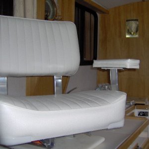 higher, wider, with arm rests