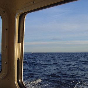 10-12 miles from nearest shore....3'+ cross chop. I think he has right away.... hm?