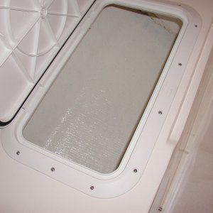 Painted with West Marine Starbrite and bedded the hatch with 4200.I figure the hatches will hold air as floatation for a while.