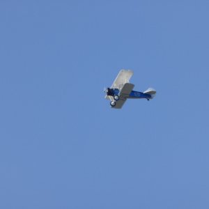 Biplane making annual appearance, doing loops and rolls over Echo Bay