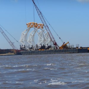 The river is very industrial between the Gulf and the I 10 bridge. Port Arther, Orange, and (on the adjoining Neches River) Beaumont, Texas all add to the heavy traffic.