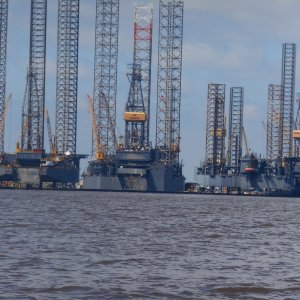 Jackup oil rigs in storage.