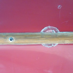 Here's a closeup. I don't have a clue on this. The spot is approx. 1 inch in diameter and is below being flush with the Gelcoat surface approx. .025" and appears to be hard as a rock when probed. The brass keel guard is not compromised or damaged and appears to be bedded in 5200. I'm at a loss on
this one! The boat has been to Lake powell once and Bellingham and the San Juans twice, so it's not like it's been in the water constantly. HELP!