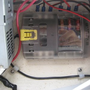 Additional fuse panel installed above overhead shelf providing room for additional electronics and requiring  only one set of  power leads running up to shelf from main fuse panel.
