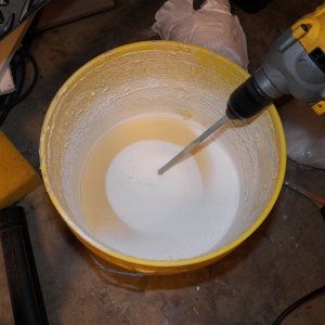 This is my home-brew insulating paint.  It is some leftover latex water proofing paint used on concrete block prior to applying a stucco finish.  It dries thick and to a consistency about like a pencil eraser.  I'm adding micro balloons to it (the secret ingredient).