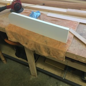 This piece goes outboard of the throttles to prevent stuff from falling behind there.