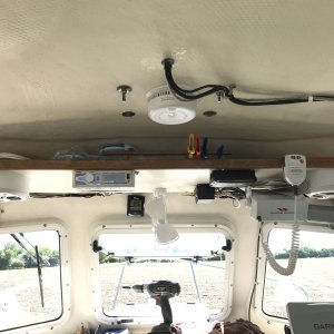 AM/FM radio and speakers added below top shelf