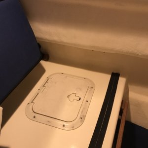 Hatch put in behind refrigerator in port seat