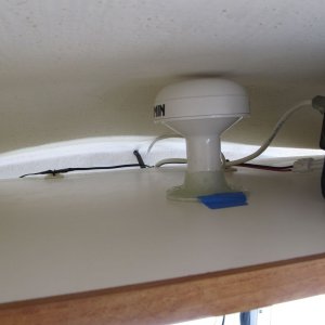 Media '' in album 'Original antenna mount. I cleaned this mount up and reused it for my new antenna. (Box in background contained new cable connector part, but contents are not shown.)'