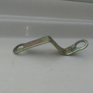 Wrench bent to miss high top