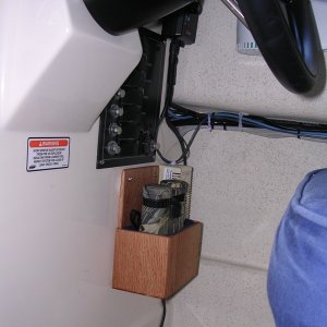 Bino rack.  1/4\" oak lined with felt.  Located below circuit breaker panel at helm station.