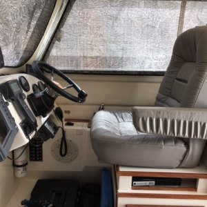Raised helm seat four inches and added chart storage area