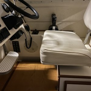 Folding helm foot rest