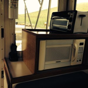 Starboard aft Microwave/ Toaster Oven shelf
+ handheld VHF and fire extinguisher