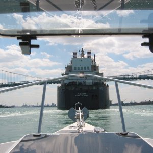 (C-batical) Approaching the stern of a 1000 foot freighter heading down the Detroit River.