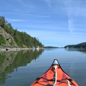 Paddling around Reid Harbor at low tide, only a few inches deep here. The Advanced Elements inflatable kayak now in its 15th year of active summer use (and year-round use for the last couple of years).