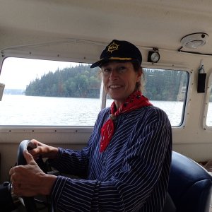 The Admiral at the helm in her German merchant marine uniform.