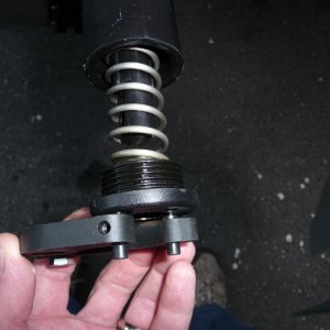 Step Three, remove the end and the spring.