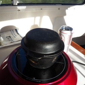 The lid doesn't get hot enough to get the top brown and crispy.  For that, I cook it for 25 minutes (so that the batter has set) and then turn it upside down for 10 minutes.  It will stay plenty hot while I cook the main course.