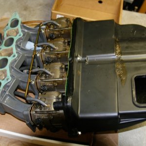 Media 'Intake, Carbs, Silencer-from-back-side:
The intake gasket and all carb gaskets should be replaced.' in album 'Main-Nozzle- showing broken and eroded end; Guessing that this was caused by previous rebuilder forcing nozzle out with a screwdriver.'