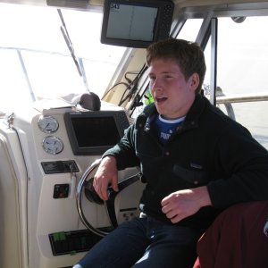 Tim at the helm - Jr's boat
