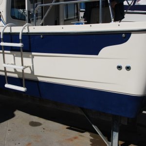 Quarter view of three rung portable ladder. Ladder stores in 'V-berth' area when not in use.