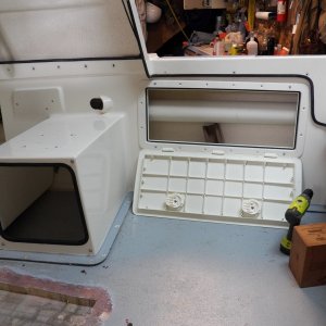 I also put an access hatch on the other side. Once the engine cables (inside the 4" plastic pipe) are moved out of the way, there should actually be some usable space in here.  The new access hatches were installed level with the cockpit deck rather than even with the cockpit trim.  That way when they are opened the entire length of the hatch is supported evenly by the cockpit deck, as shown here.  Protecting the plastic hinges seemed more important than aesthetics.