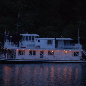 (MInnie Swann) It is the most relaxing thing to see these boats drift by at night.