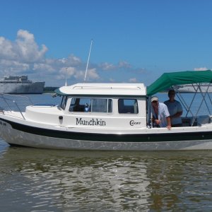Media 'C-Brats bidding farewell to MUCHKIN near the ghost fleet on the James' in album 'OSPREY\'s dock hosting some of the cruising gang\'s boats. Yes, it was raining.'