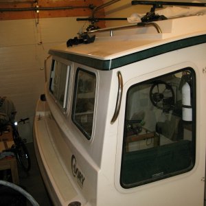 Media 'grab rails, radar arch backcut, epoxied and remounted' in album 'hatches, fuel fills, rod holders, downriggers back cut, filled with epoxy and glassed'