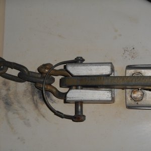 It is a piece of heavy duty square aluminum tubing with a hole for a keeper pin.  The pin goes through the hole in the shank of the anchor and secures it to the deck.