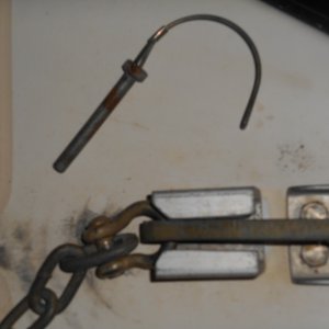 The pin looks to be the type used on tractors (I bought a spare at Tractor Supply), does not rust, and can be clipped to the rail when not in use.