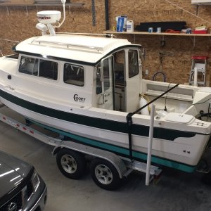 Media 'C-You-Later in storage. Garage is 30'x 40' Has in-floor heat and water.' in album 'New Garage. (view from the east). Man Door and Boat access. Boat door is 14' high and 12' wide.'