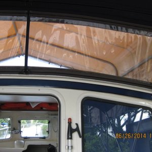 Clear isinglass attachment to bimini