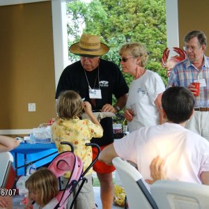 Tom,Anne and Riley drawing names for prizes.