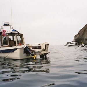 with bodega jim and his 1985 classic 22 angler, backside of santa cruz island  in march of 2003