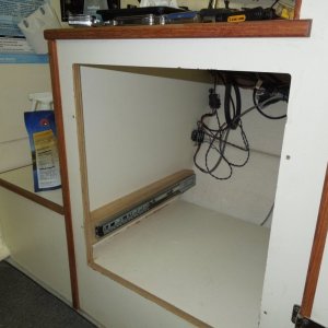 Area under helm seat where refrigerator was located.